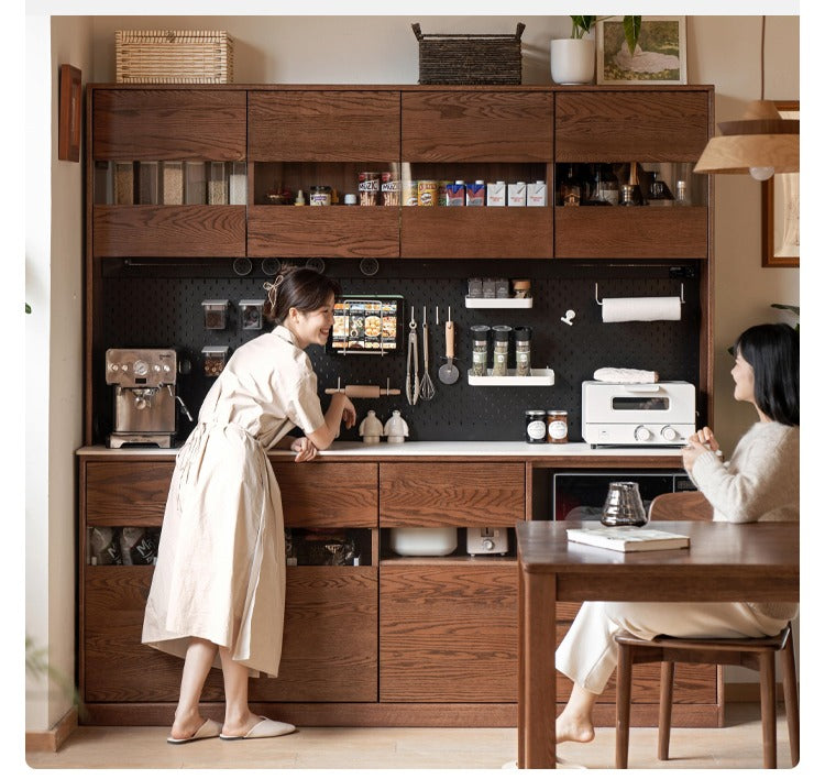 Oak solid wood dining storage sideboard against the wall,